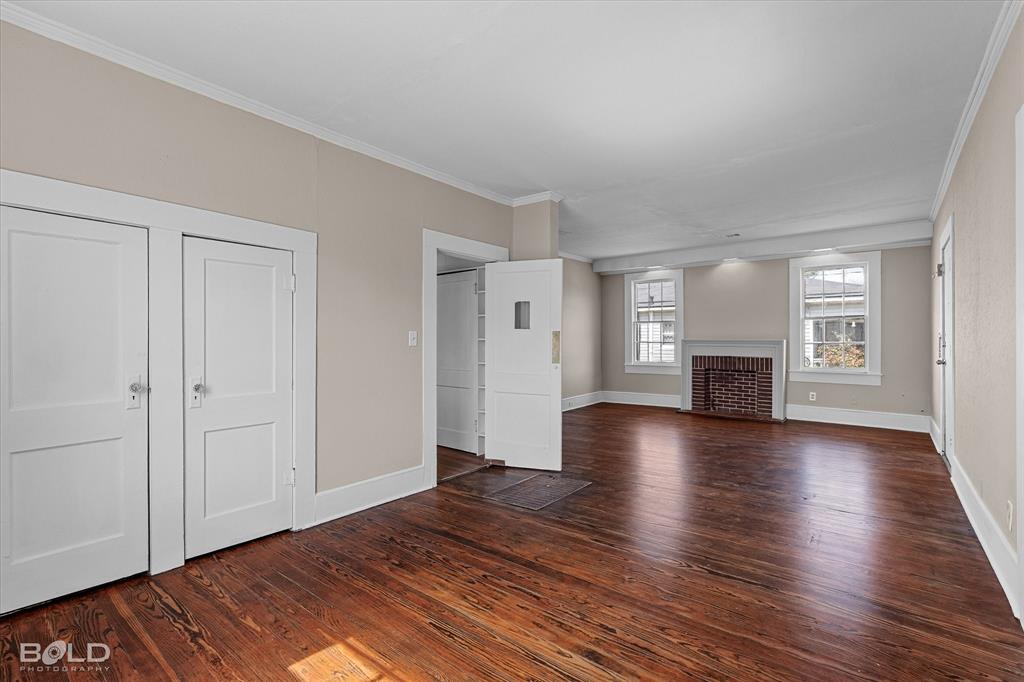 323 Butler Road Belcher, LA 71004 - Photo 9 of 28 a view of empty room with window and wooden floor