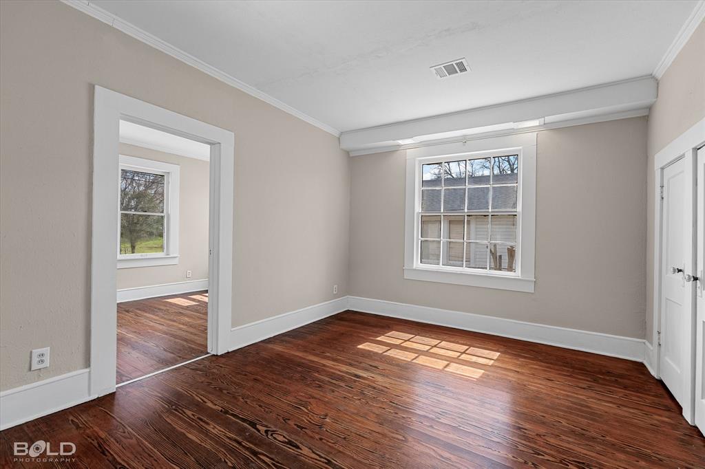 323 Butler Road Belcher, LA 71004 - Photo 10 of 28 a view of empty room with wooden floor and fan
