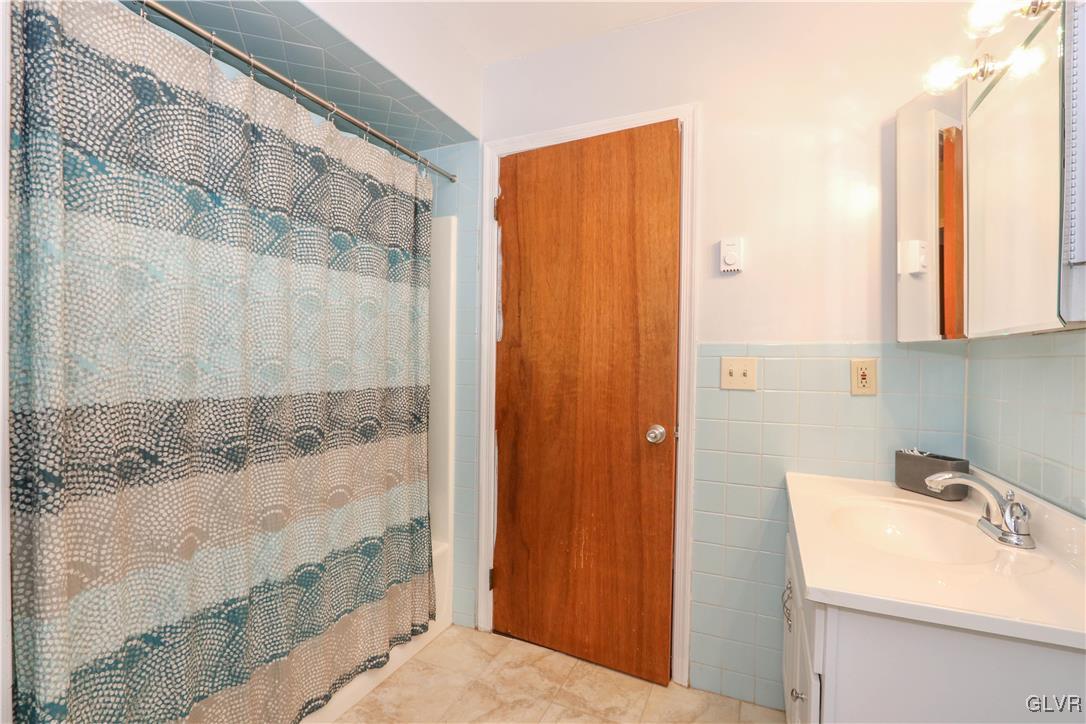 4025 Devonshire Road Bethlehem, PA 18020 - Photo 20 of 33 Tub and Shower Behind with Floor to Ceiling Tile i