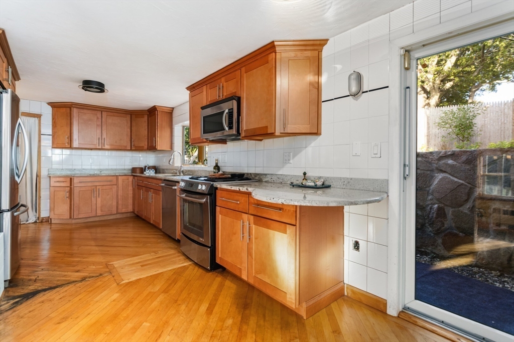 75 Bay View Drive Swampscott, MA 01907 - Photo 12 of 41 a kitchen with stainless steel appliances granite countertop a stove a sink and a refrigerator