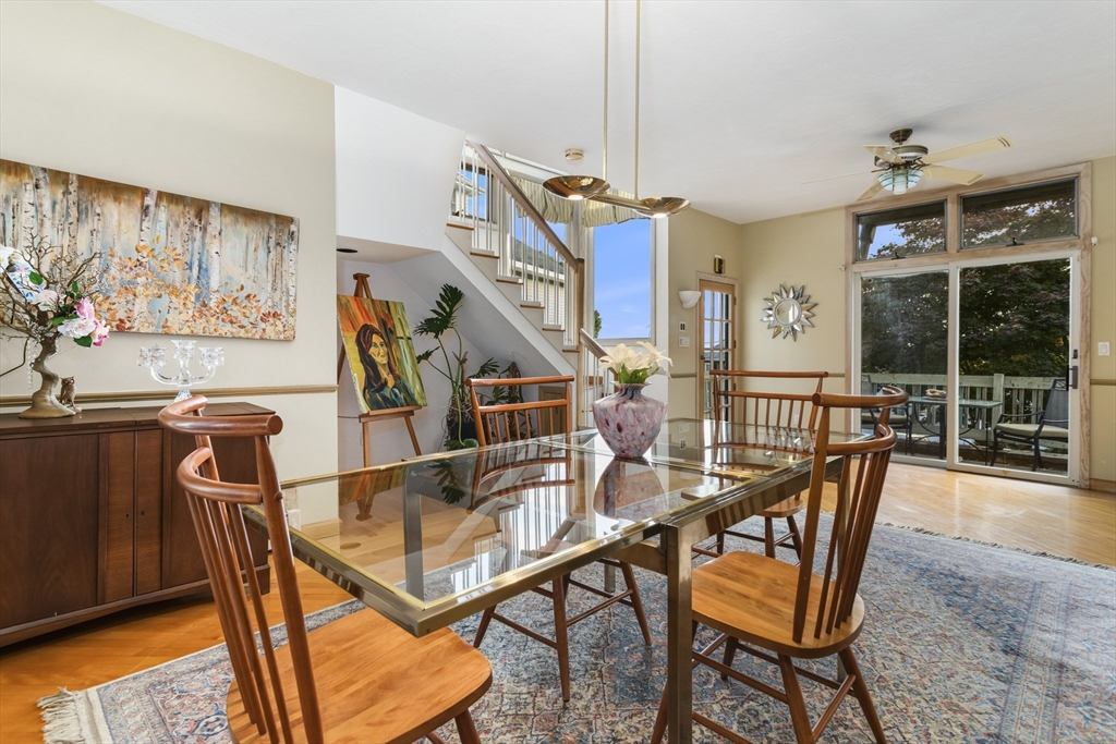 75 Bay View Drive Swampscott, MA 01907 - Photo 13 of 41 a dining room with furniture and a floor to ceiling window