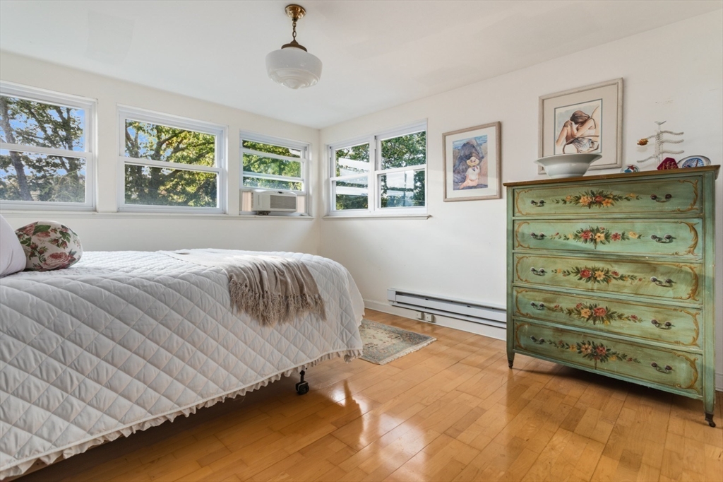 75 Bay View Drive Swampscott, MA 01907 - Photo 20 of 41 a bedroom with a bed and a window