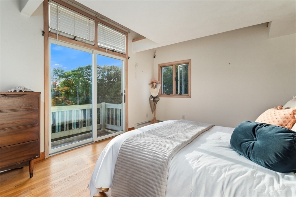 75 Bay View Drive Swampscott, MA 01907 - Photo 22 of 41 a bed sitting in a bedroom next to a window
