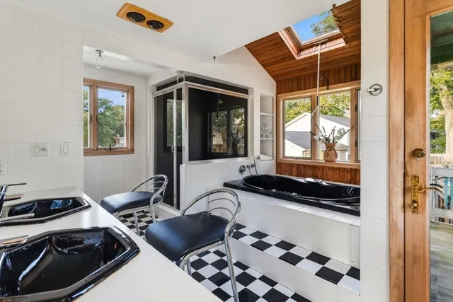 a blue and white top oven sitting next to a window