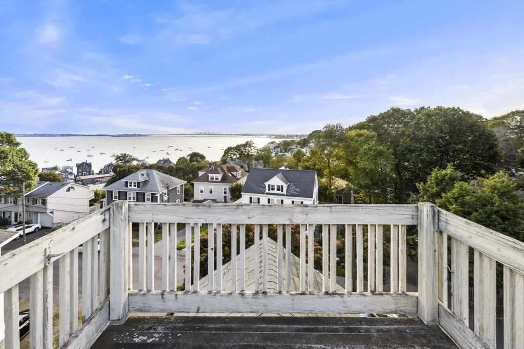75 Bay View Drive Swampscott, MA 01907 - Photo 30 of 41 a view of a balcony with wooden floor and fence