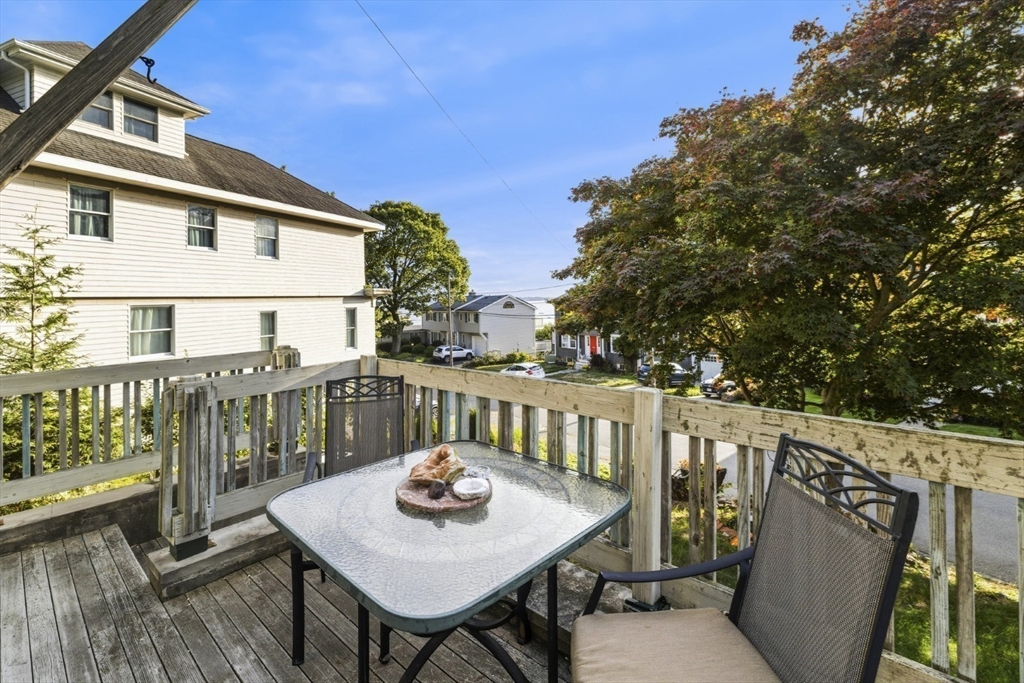 75 Bay View Drive Swampscott, MA 01907 - Photo 31 of 41 a view of a balcony with wooden floor and outdoor seating