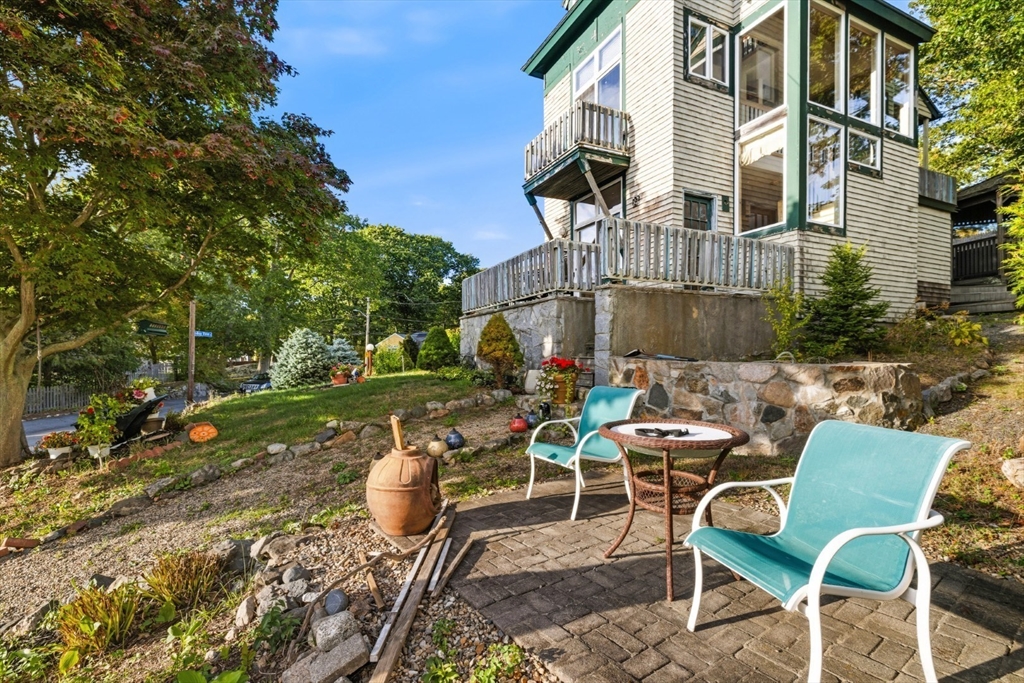 75 Bay View Drive Swampscott, MA 01907 - Photo 4 of 41 a view of a patio with table and chairs and potted plants