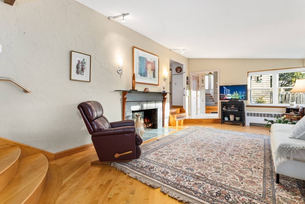75 Bay View Drive Swampscott, MA 01907 - Photo 8 of 41 a living room with furniture and a fireplace