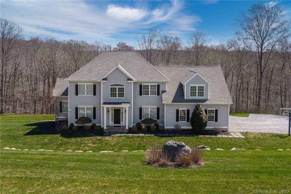 73 Beaver Dam Road Killingworth, CT 06419 - Photo 1 of 1 a front view of a house with a garden