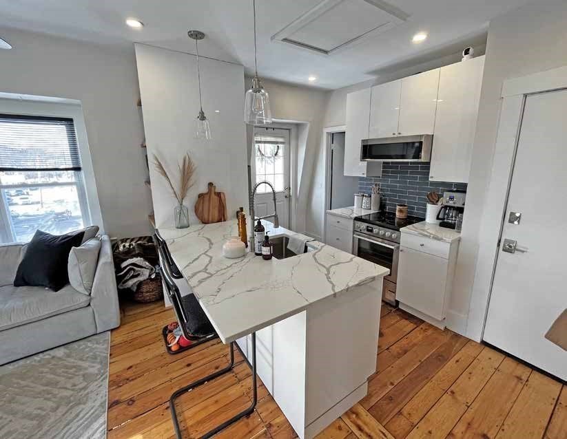 52 North Main Street Natick, MA 01760 - Photo 14 of 25 a view of a kitchen with sink and dishwasher