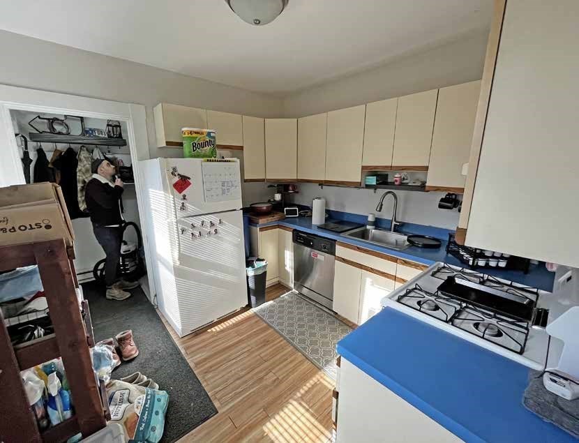 52 North Main Street Natick, MA 01760 - Photo 15 of 25 a kitchen with stainless steel appliances a stove a sink and a refrigerator