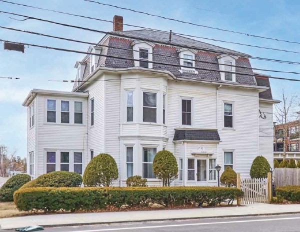 52 North Main Street Natick, MA 01760 - Photo 3 of 25 a front view of a building with windows