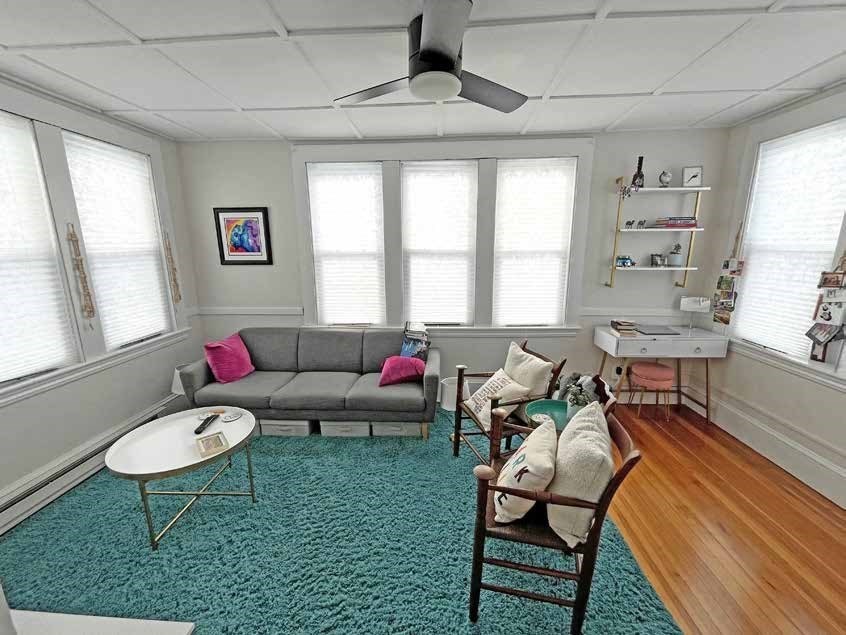 52 North Main Street Natick, MA 01760 - Photo 10 of 25 a living room with furniture a rug and a window
