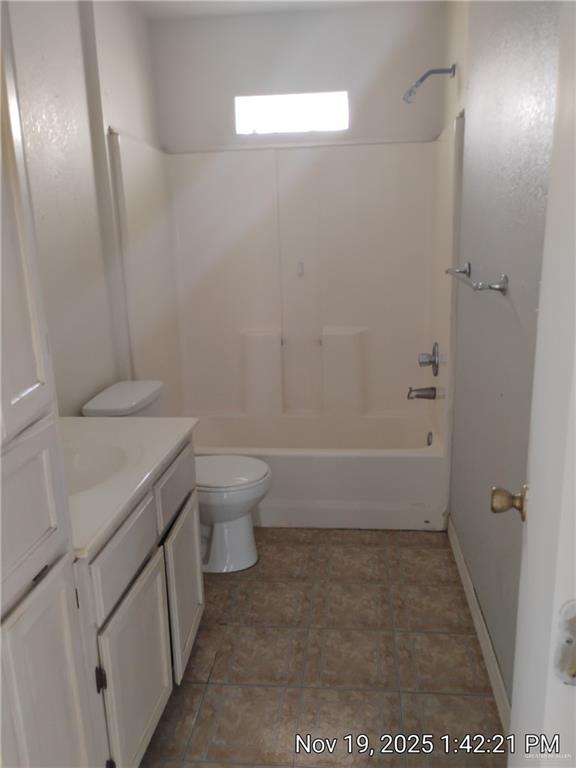 2031 Lake View Drive Mission, TX 78572 - Photo 12 of 13 a bathroom with a granite countertop sink toilet and shower