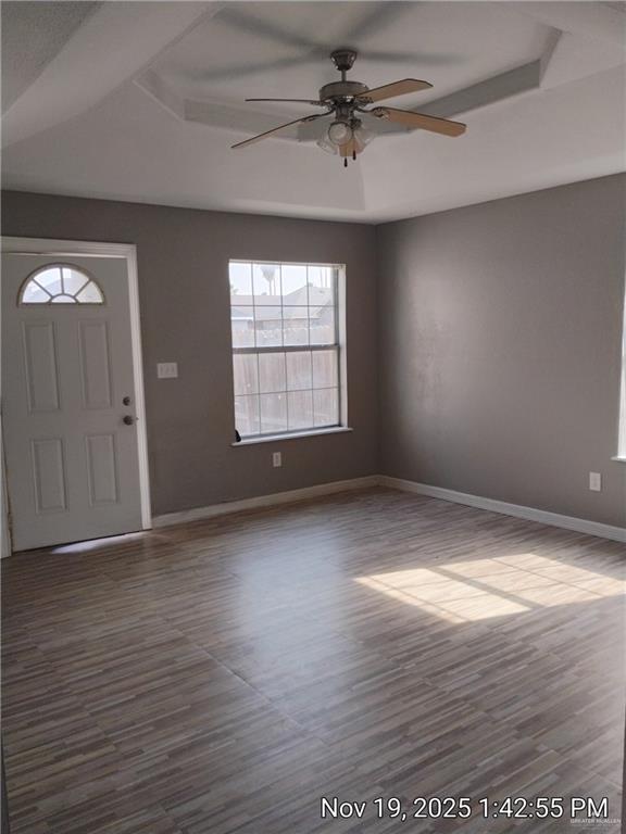 2031 Lake View Drive Mission, TX 78572 - Photo 4 of 13 an empty room with wooden floor and windows