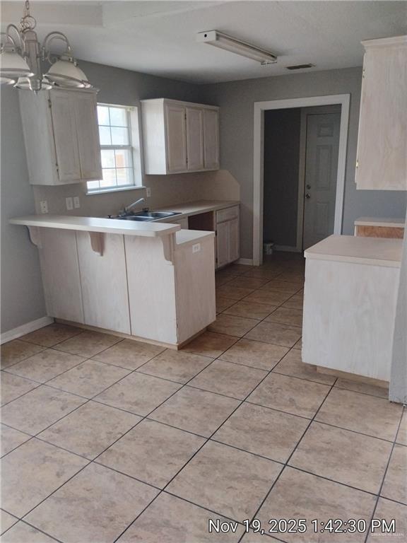 2031 Lake View Drive Mission, TX 78572 - Photo 6 of 13 a kitchen with a cabinets and window