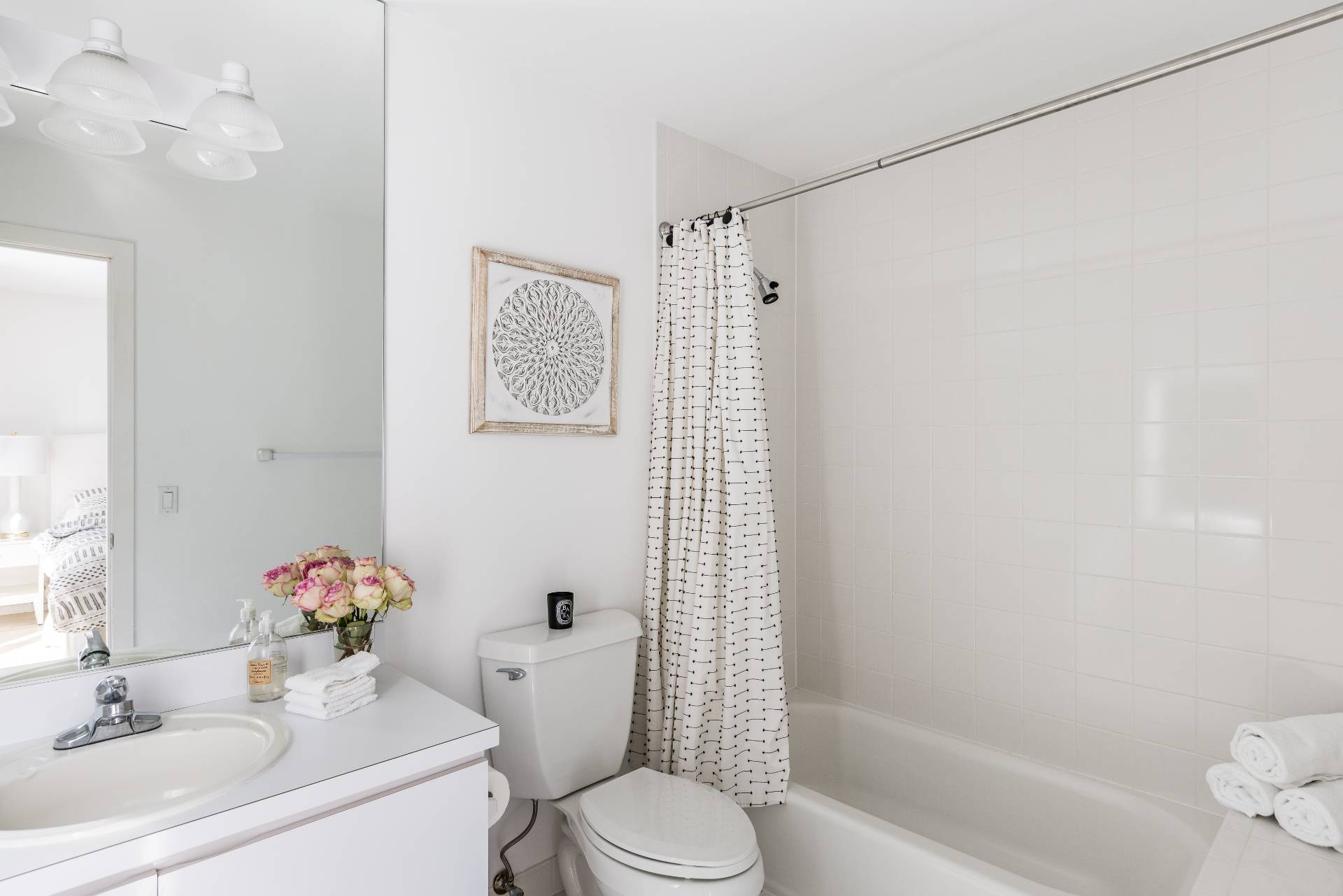 52 Bull Path East Hampton, NY 11937 - Photo 14 of 24 a bathroom with a sink toilet and shower