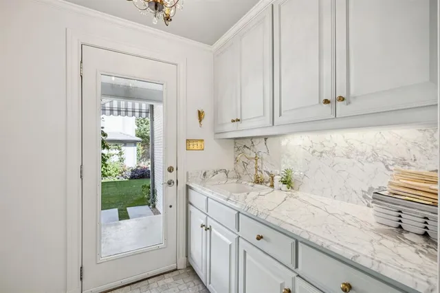 a kitchen with granite countertop a sink