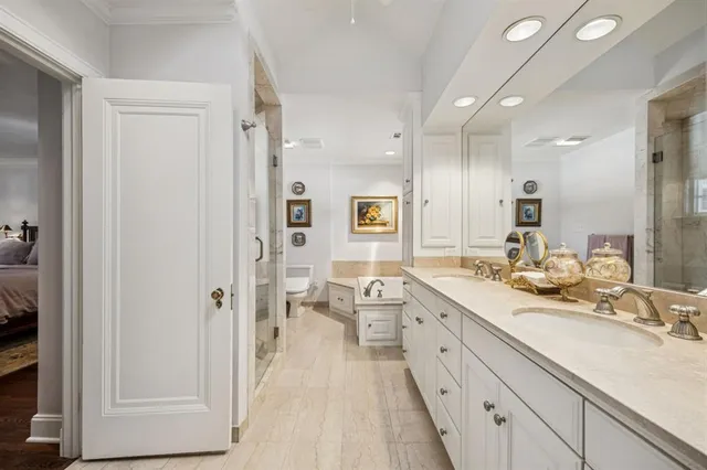 a spacious bathroom with a double vanity sink a mirror and a shower