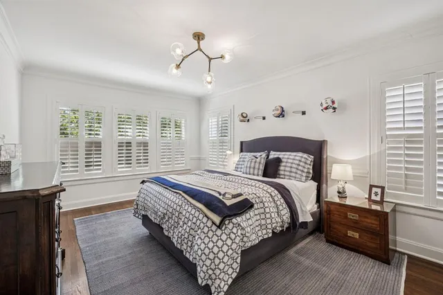 a spacious bedroom with a large bed and a window