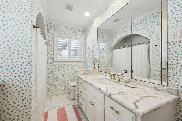 a bathroom with a sink a vanity and a mirror