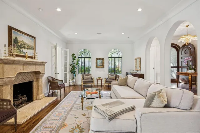 a living room with furniture fireplace and window