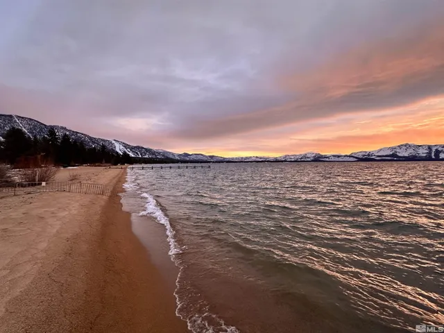 a view of a lake with a house in the background