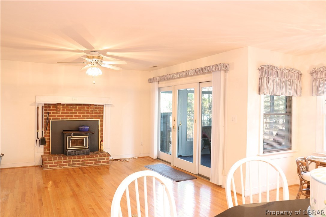 97 Barnes View Lane Kilmarnock, VA 22482 - Photo 9 of 20 Family room off kitchen opens to great room and sun room, again with views of the water.
