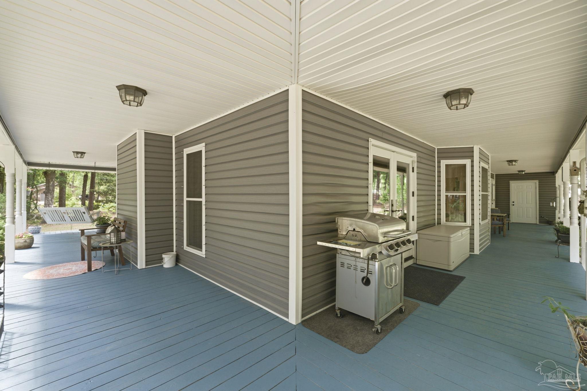 6930 Summit Way Milton, FL 32570 - Photo 46 of 71 a view of a room with furniture and wooden floor