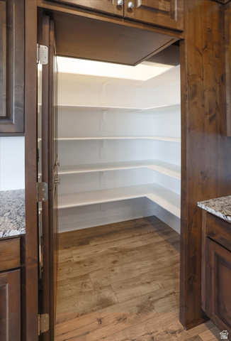 3636 West 910 South Syracuse, UT 84075 - Photo 37 of 70 Spacious walk-in pantry with wood-finish flooring, ample white shelving, and recessed lighting
