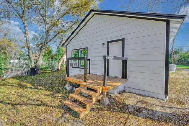 a backyard of a house with seating space