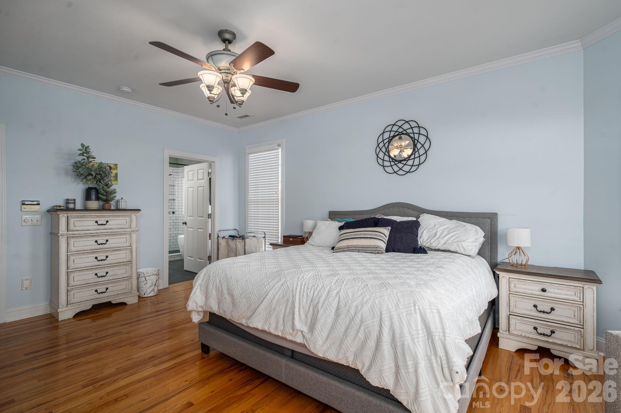 2616 Nicklaus Court Conover, NC 28613 - Photo 14 of 48 a bedroom with a bed and a chandelier