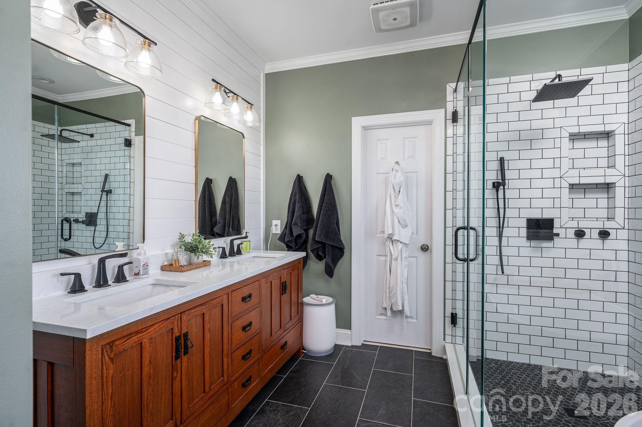 2616 Nicklaus Court Conover, NC 28613 - Photo 15 of 48 a bathroom with a double vanity sink and a mirror