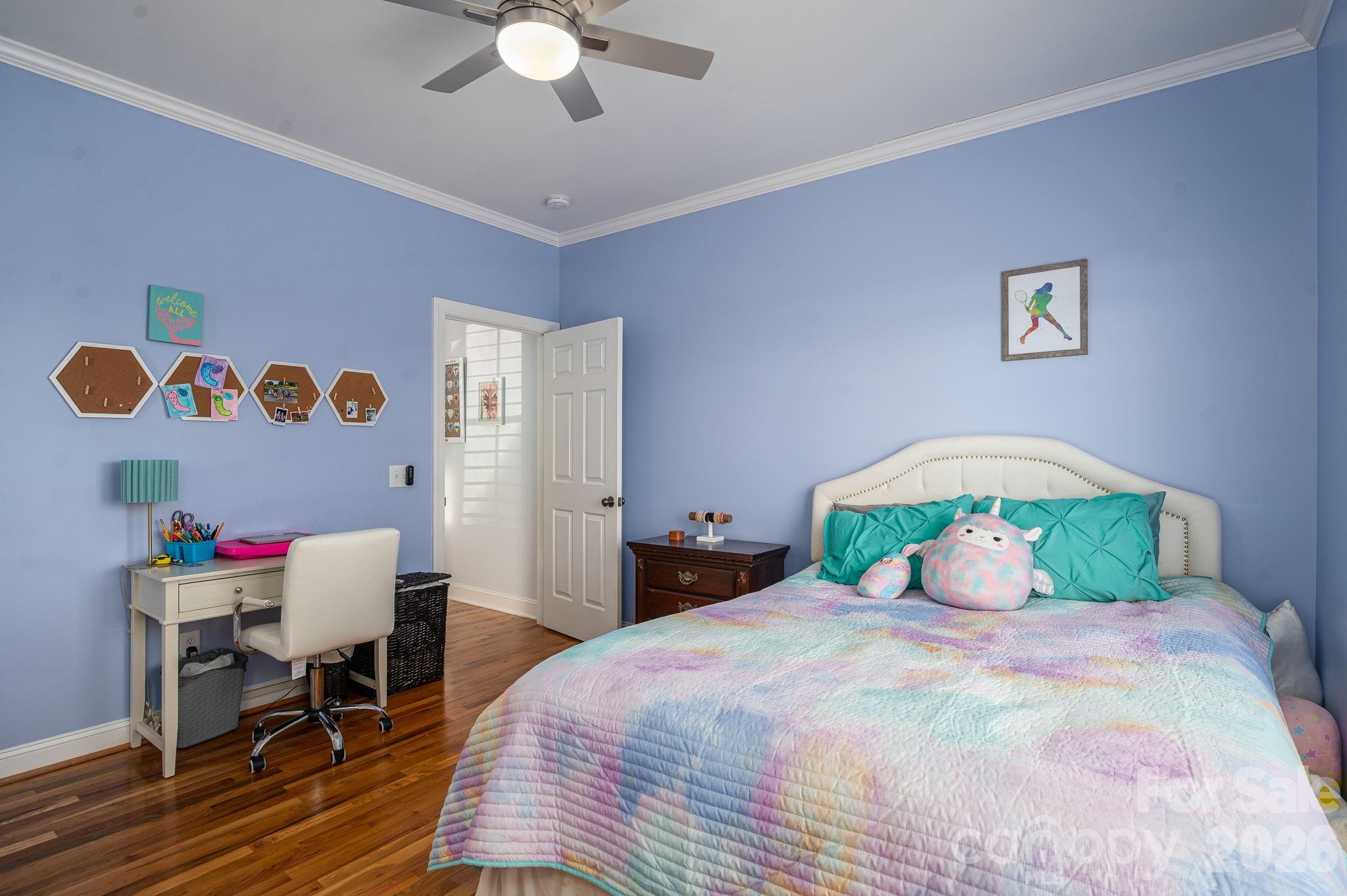 2616 Nicklaus Court Conover, NC 28613 - Photo 18 of 48 a bedroom with a bed and a chandelier