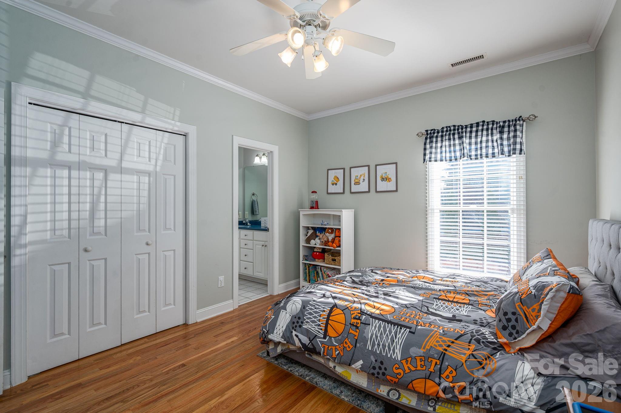 2616 Nicklaus Court Conover, NC 28613 - Photo 20 of 48 a bedroom with a bed and a chandelier