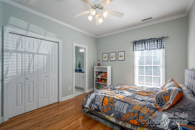 a bedroom with furniture and a chandelier