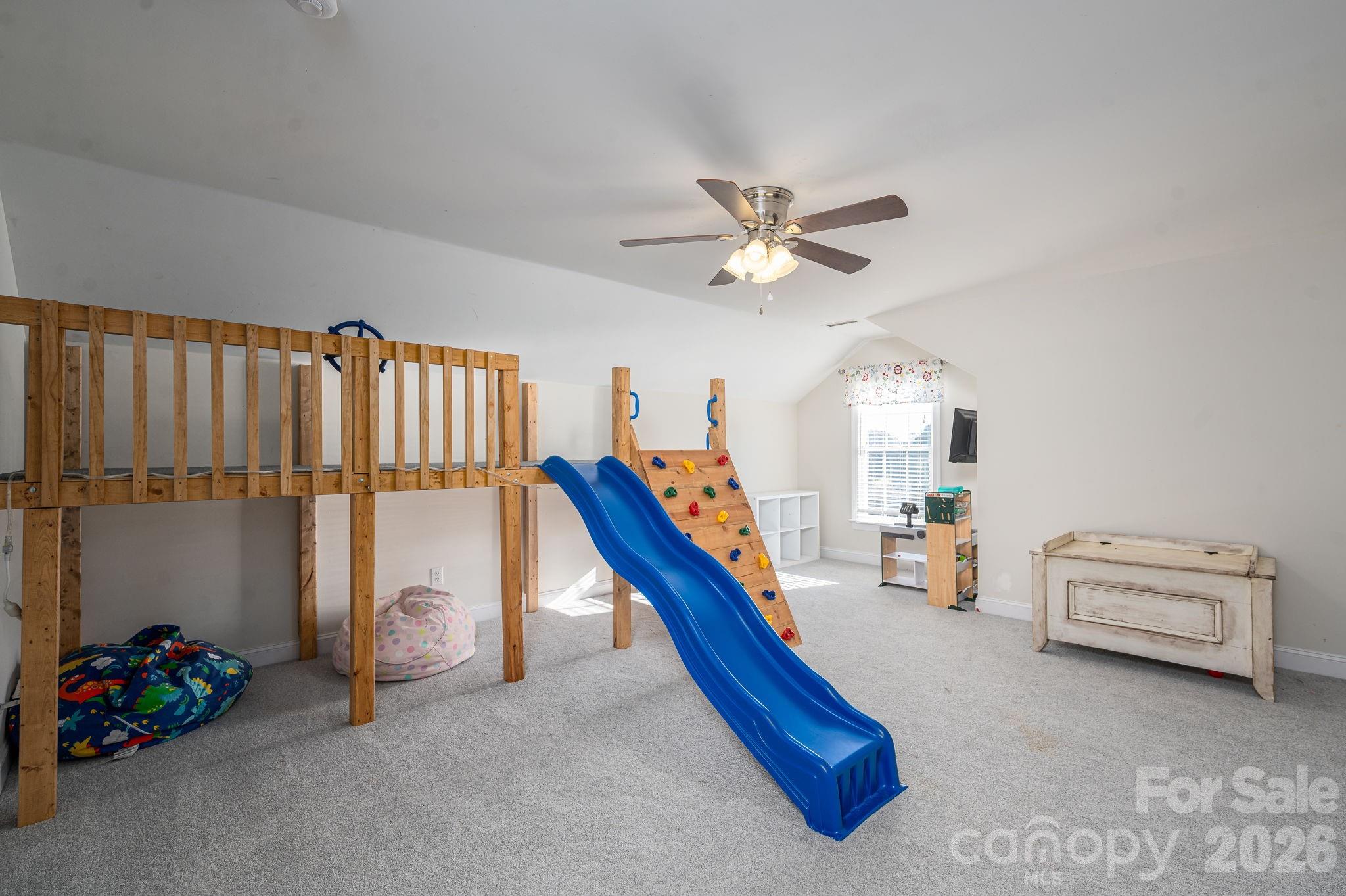 2616 Nicklaus Court Conover, NC 28613 - Photo 21 of 48 a bedroom with furniture and a chandelier