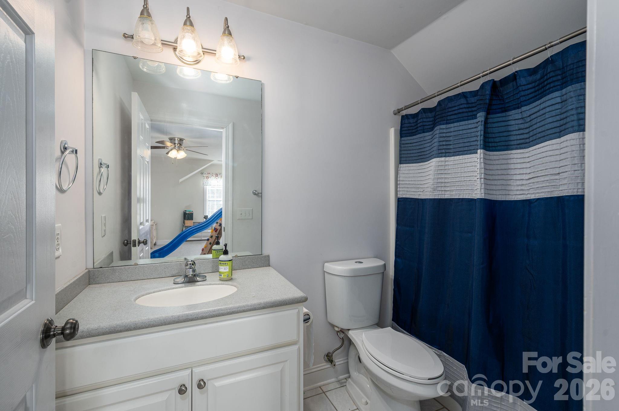 2616 Nicklaus Court Conover, NC 28613 - Photo 22 of 48 a bathroom with a sink a toilet and mirror