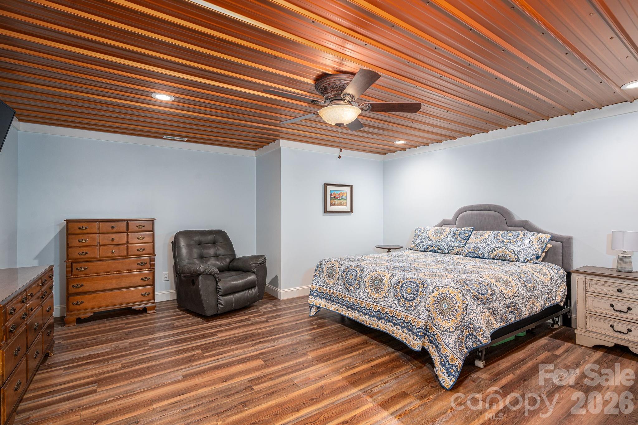 2616 Nicklaus Court Conover, NC 28613 - Photo 28 of 48 a bedroom with a bed and a chandelier