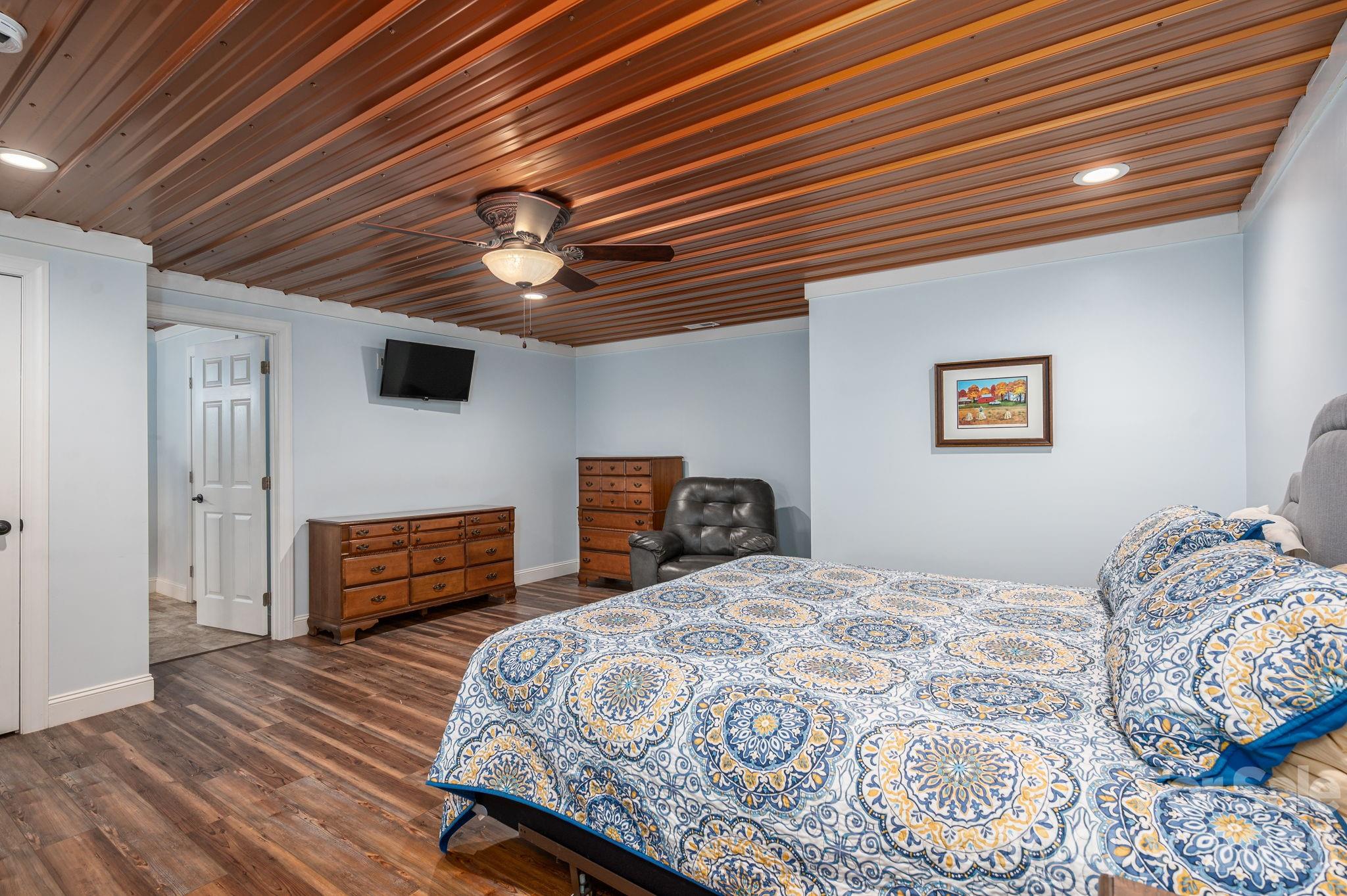 2616 Nicklaus Court Conover, NC 28613 - Photo 29 of 48 a bedroom with a bed and a chandelier