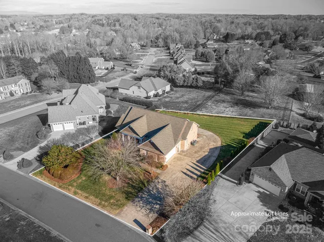 an aerial view of a house with outdoor space