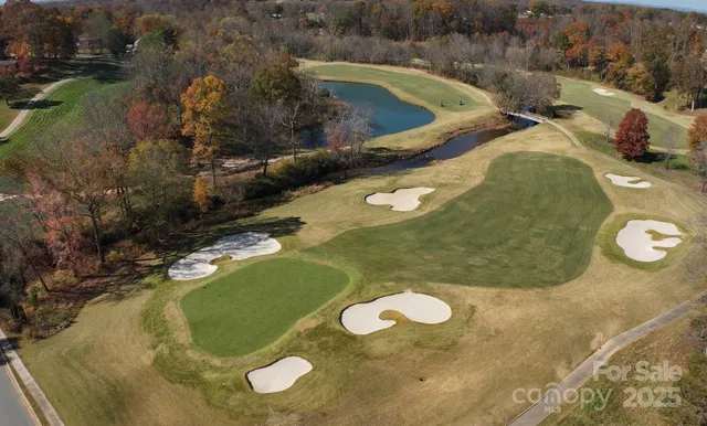 a sign that is sitting in front of flowers