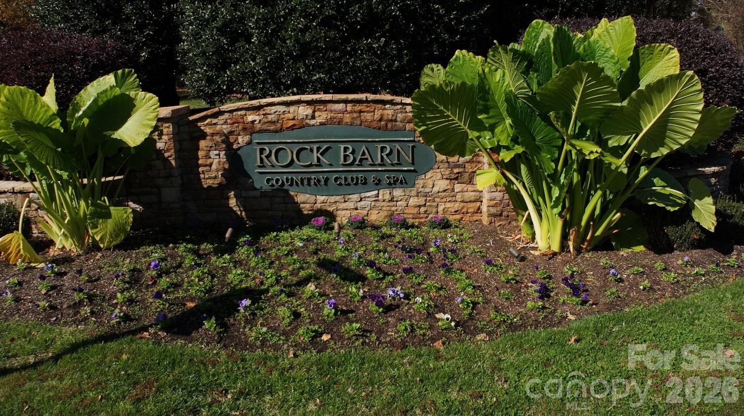 2616 Nicklaus Court Conover, NC 28613 - Photo 47 of 48 a sign that is sitting in front of flowers