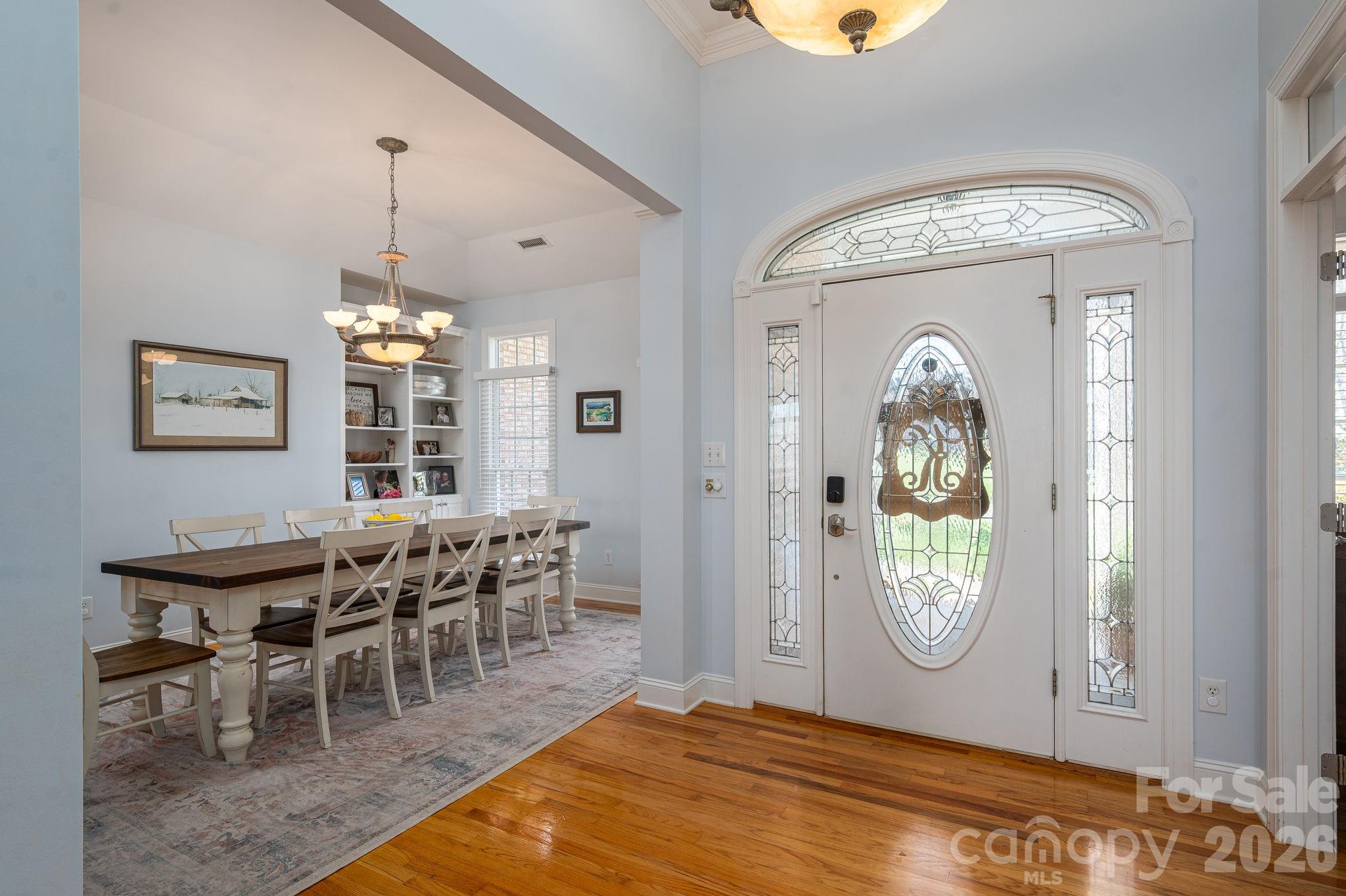 2616 Nicklaus Court Conover, NC 28613 - Photo 5 of 48 a view of a dining room with furniture window and wooden floor