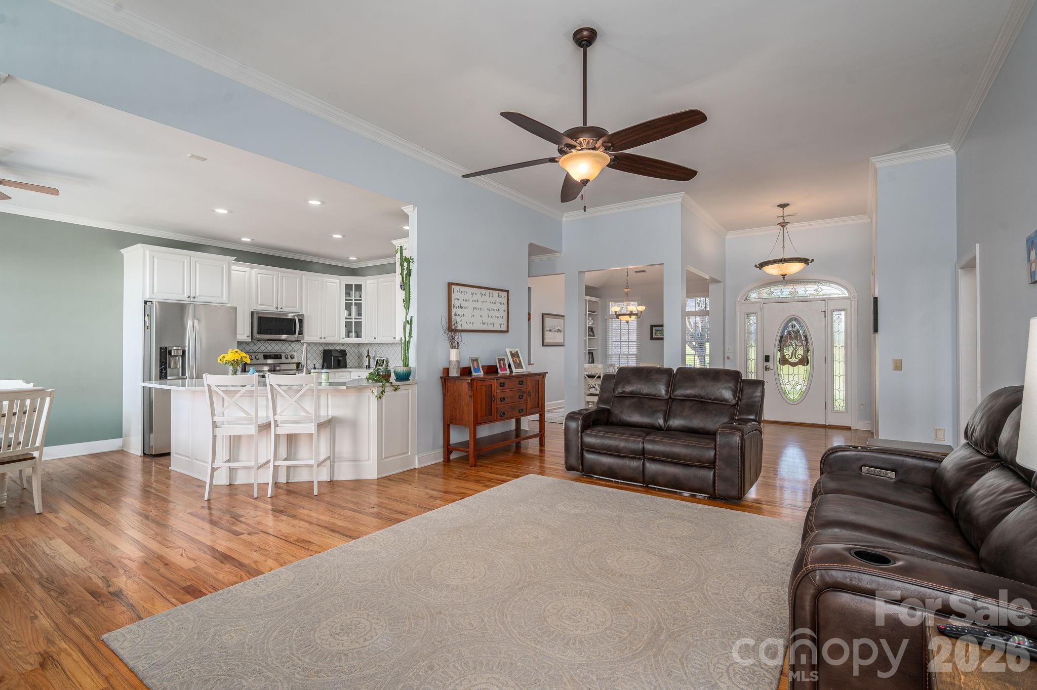 2616 Nicklaus Court Conover, NC 28613 - Photo 7 of 48 a living room with furniture kitchen view and a chandelier