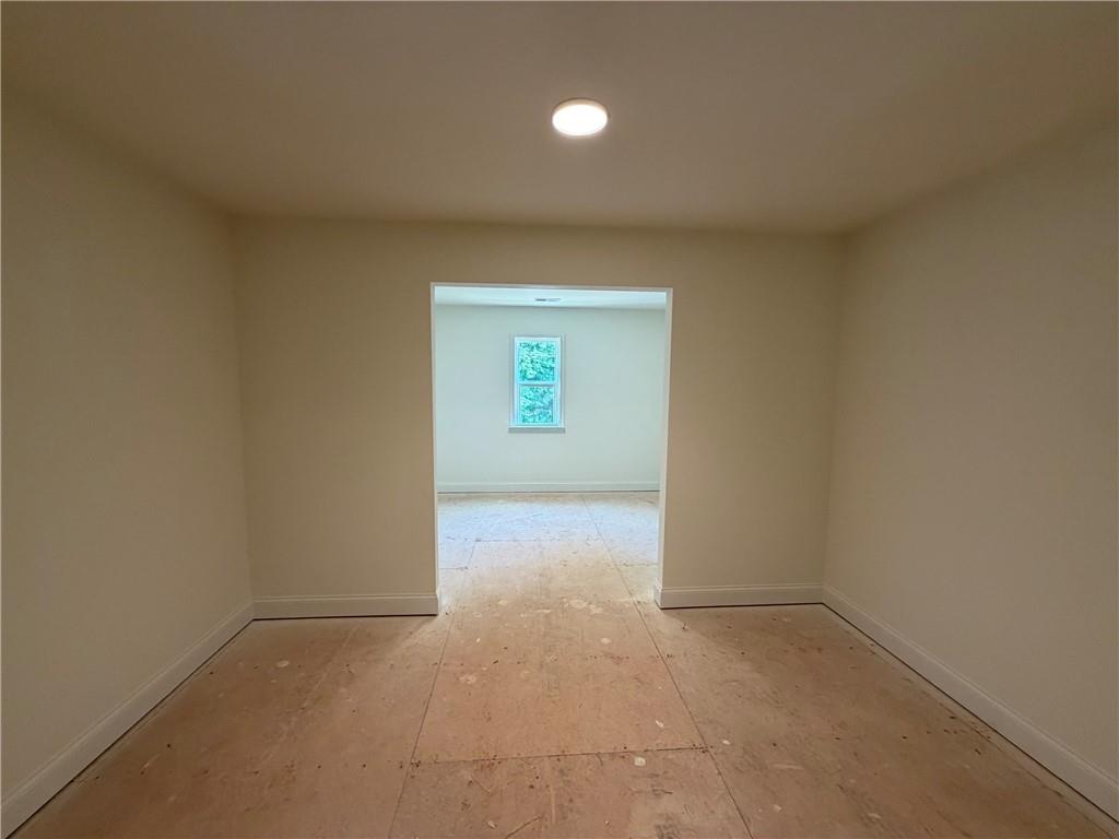 41 Woodland Road Covington, GA 30016 - Photo 10 of 46 an empty room with windows