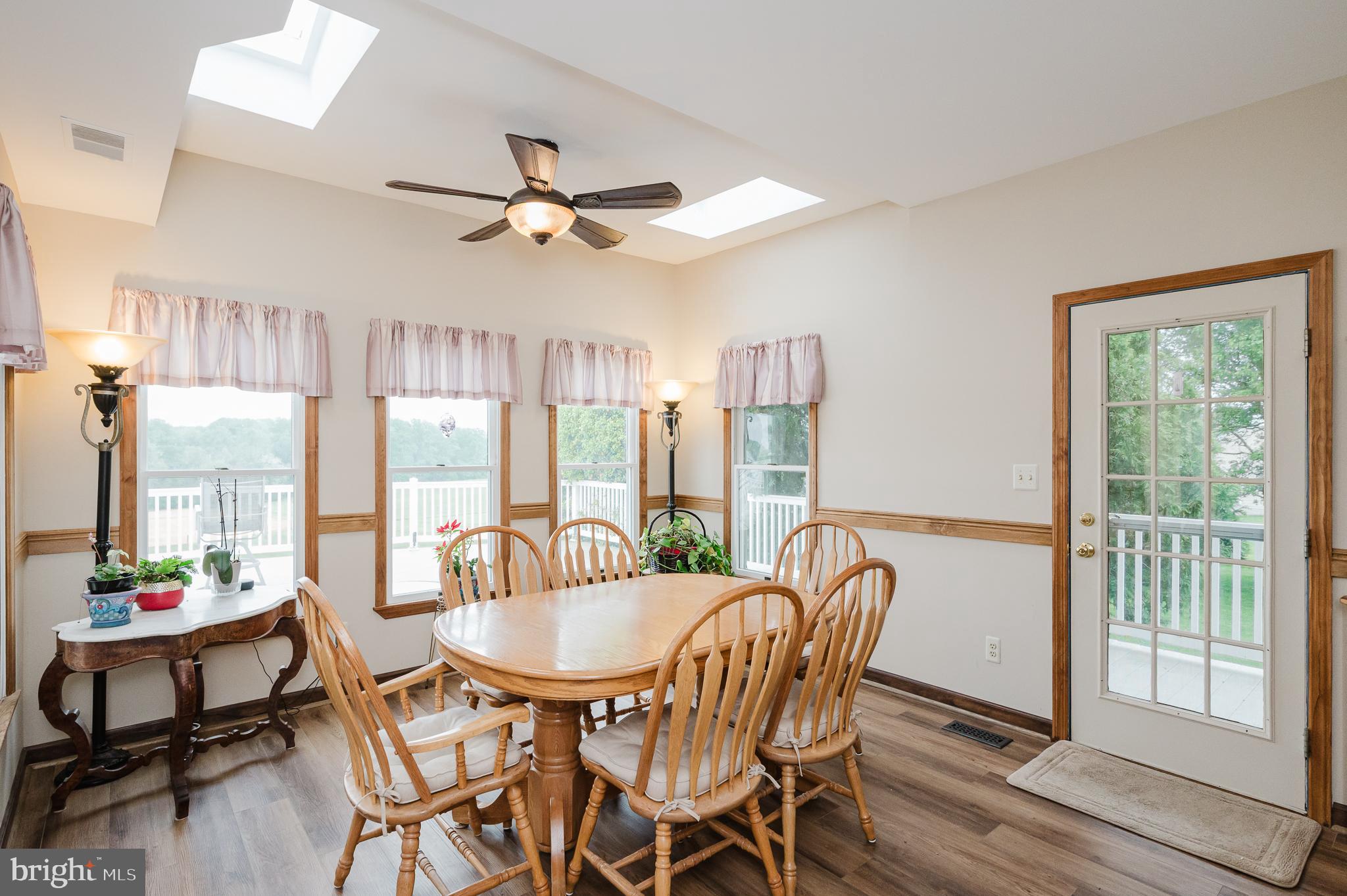 2555 Baldwin Mill Road Baldwin, MD 21013 - Photo 18 of 110 a view of a dining room with furniture window and wooden floor
