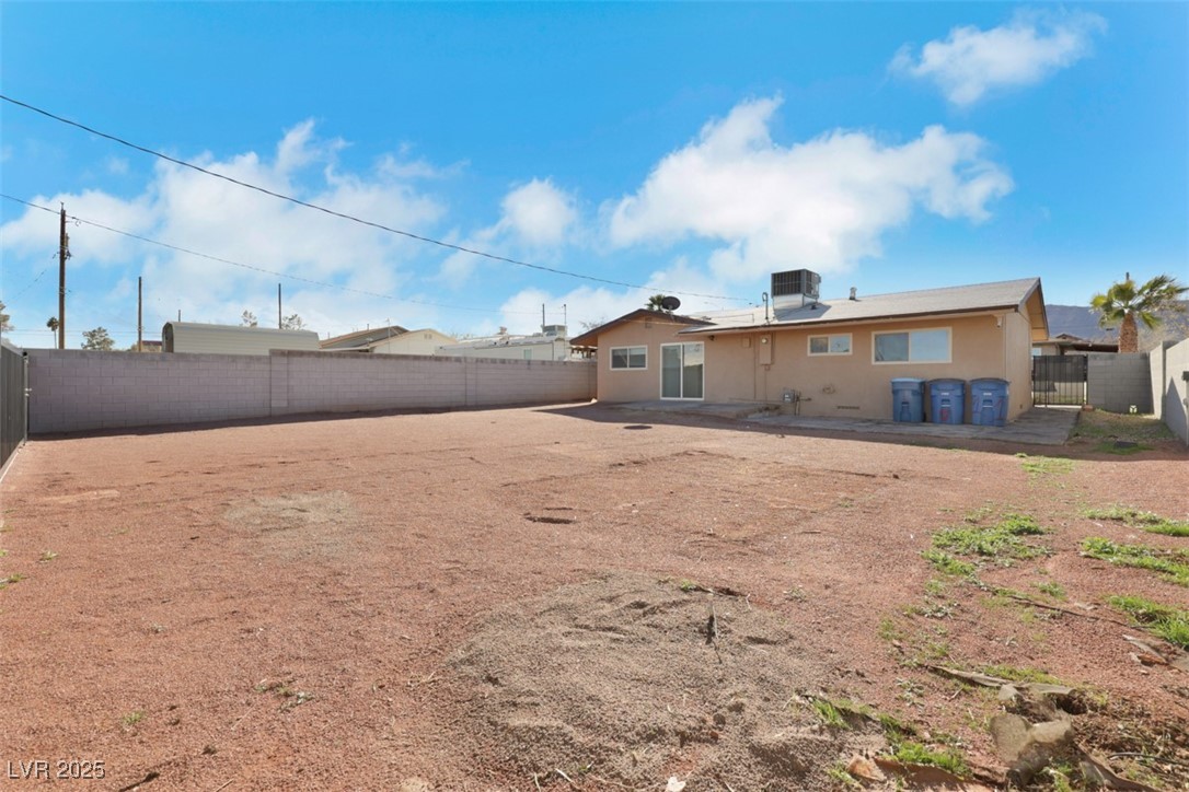 11 California Way Henderson, NV 89015 - Photo 16 of 17 Back of property with a fenced backyard, stucco siding, and a patio