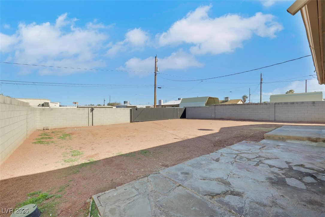 11 California Way Henderson, NV 89015 - Photo 17 of 17 Fenced backyard with a patio