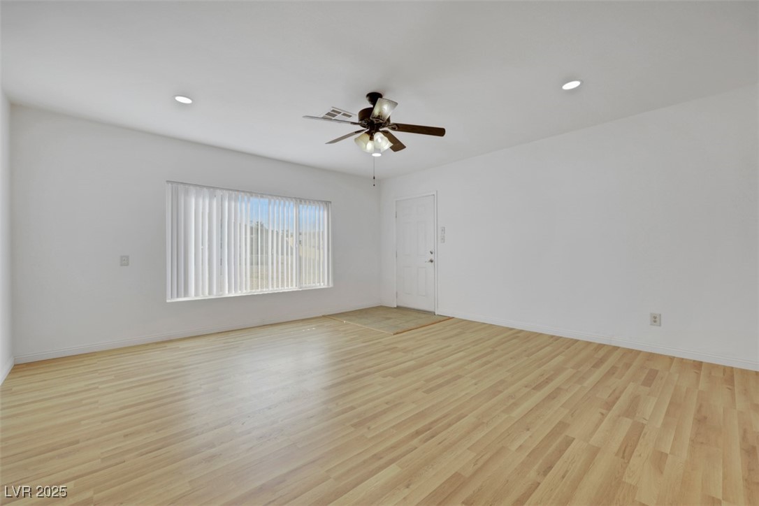 11 California Way Henderson, NV 89015 - Photo 3 of 17 Spare room featuring light wood-style flooring, recessed lighting, and ceiling fan